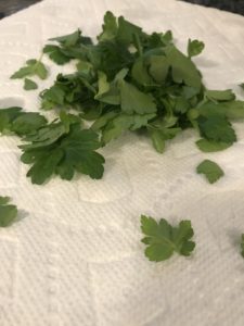 How to Dry Parsley Step 4: Remove the parsley leaves from the stalks.